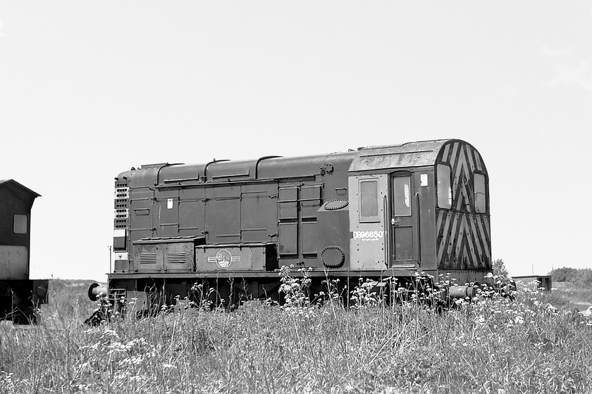 DB966507, snowplough, stabled, March Yard 
 DB966507 sits at March Yard still painted in its green livery complete with the British Railways logo on the side. This converted shunter was one of three that were built as snow ploughs. All work was completed at Doncaster Works in 1973 so it never received its TOPS number. 
 Keywords: DB966507 snowplough stabled, March yard