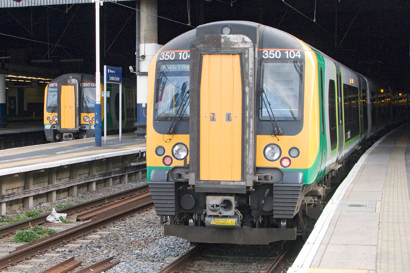 350104, 350249 & 350371, LM 13.34 London Euston-Birmingham New Street (2Y23) & 350124, LM 13.54 London Euston-Milton Keynes Central (2K25), London Euston station 
 London Midland class 350s stand at Euston waiting to work north. To the left is 350124 that will form the 13.54 stopper to Milton Keynes. Whilst to the right, 350104, 350249 and 350371 wait to leave working the 13.34 to Birmingham New Street. My wife and I took this service as far as Northampton. 
 Keywords: 350104 350249 350371 13.34 London Euston-Birmingham New Street 2Y23 350124 13.54 London Euston-Milton Keynes Central 2K25 London Euston station