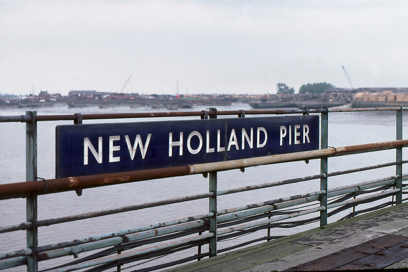 Enamel, New Holland Pier 
 A superb British Railways (ER) enamel sign on New Holland Pier. Notice that the sign is split into two parts due to its size. I hope that somebody is the current day custodian of this magnificent sign and that it was not simply removed and thrown away when the pier was closed to railway traffic less than a week after this photograph was taken. 
 Keywords: Enamel New Holland Pier Enamel sign