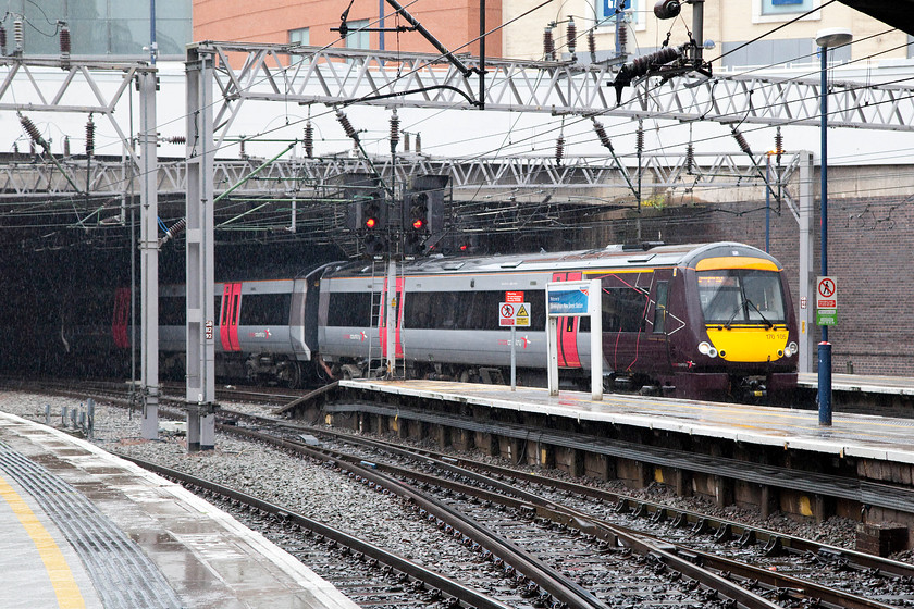 170105, XC 05.15 Cambridge-Birmingham New Street (1N40), Birmingham New Street station 
 In the pouring rain, 170105 arrives at Birmingham New Street with the 05.15 CrossCountry service from Cambridge. For once, I was grateful to be sheltering under the roof of the station usually being happier to out on the exposed platform ends at New Street. 
 Keywords: 170105 05.15 Cambridge-Birmingham New Street 1N40 Birmingham New Street station