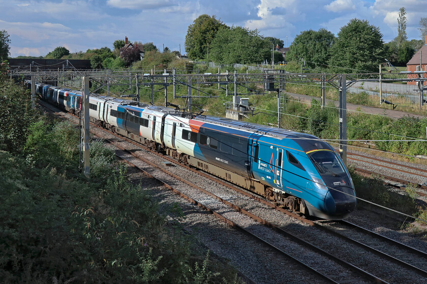 805005 & 805008, 12.48 Holyhead-London Euston (1A42, 14L), site of Roade station 
 The Evero revolution continues, if a little slowly! 805005 and 805008 work the 1A42 12.48 Holyhead to Euston service. Whilst I would hope that these trains are a step up from the Voyagers they, like the diesels, require double manning with no inter-connecting facility. Smart in their fresh Avanti paintwork the pair pass the village of Roade and a pleasantly warm Sunday afternoon 
 Keywords: 805005 805008 12.48 Holyhead-London Euston 1A42 site of Roade station