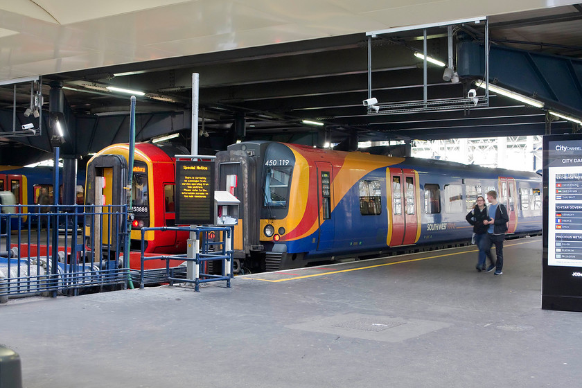 158886, SW 11.50 London Waterloo-Salisbury (1L31, 1E) & 450119, SW 11.30 London Waterloo-Portsmouth Harbour (1P31, RT), London Waterloo station 
 Some of Waterloo's hundreds of CCTV cameras will be picking me up no doubt! Here they would see me acting suspiciously and photographing 158886 waiting to leave the station with the 1L31 service to Salisbury. Next to that, is 450119 just getting the right-away as the 11.30 to Portsmouth Harbour. 
 Keywords: 158886 11.50 London Waterloo-Salisbury 1L31 450119 11.30 London Waterloo-Portsmouth Harbour 1P31 London Waterloo station