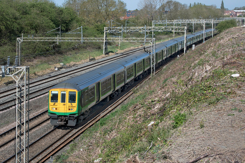 319441, 319012 &-319460, 11.02 Northampton EMD-Bletchley CS ECS (5B19, 8E), Ashton Road bridge 
 The ex Thameslink Class 319s are pretty scattered about now with London Northwestern retaining a few for commuter work. With the COVID-19 crisis in full swing, I suspect that these units have seen little work so quite why they were being moved from Northampton to Bletchley is a bit of a mystery. 319441, 319012 and 319460 are about to pass under Ashton Road bridge as the 11.02 from Northampton's Kingsheath depot to Bletchley 5B19 empty coaching stock working. 
 Keywords: 319441 319012 319460 11.02 Northampton EMD-Bletchley ECS CS 5B19 Ashton Road bridge London Northwestern