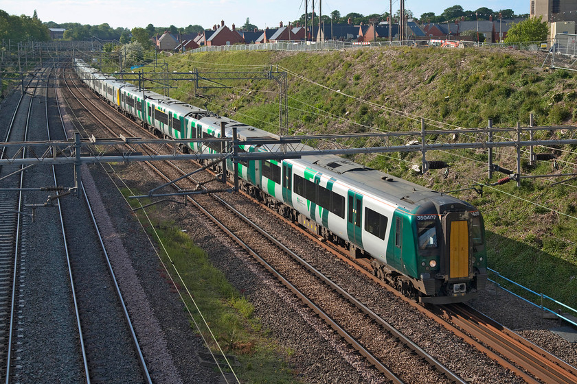 350407, LN 17.45 Northampton-London Euston (2N58, 2L), Ashton Road bridge 
 In the evening light 350407 leads two other classmates past Roade's Ashton Road bridge leading the 17.45 Northampton to London Euston service. This Desiro is one of the sets inherited from TransPennine Express with this one last seen when I visited Edinburgh Waverley in August 2016, see....... https://www.ontheupfast.com/p/21936chg/25778333004/x350407-10-12-edinburgh-waverley 
 Keywords: 350407 17.45 Northampton-London Euston 2N58 Ashton Road bridge London Nortwestern Desiro