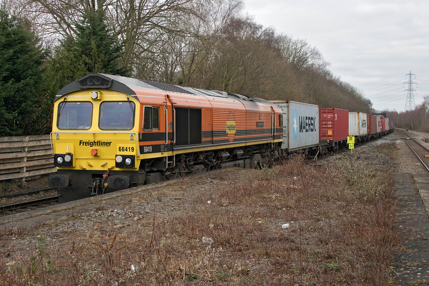 66419, 09.52 Lawley Street-Felixstowe North (4L99, 1L), Water Orton station 
 Just one more train of interest kept us on Water Orton's desolate and cold platforms! 66419 'Lionesses' Roar' leads the 4L99 Lawley Street to Felixstowe Freightliner service. that was certainly working at line speed whipping past us and disturbing the chilly air! The Class 66 was named in October last year (2022) some months after the England women's team won the Euros at Wembley in July. I am very pleased that the apostrophe has been applied in the correct place on the nameplate! 
 Keywords: 66419 09.52 Lawley Street-Felixstowe North 4L99 Water Orton station Lionesses' Roar Freightliner Genesee & Wyoming