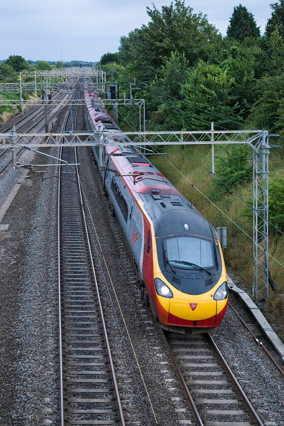 Class 390, VT 18.30 London Euston-Glasgow Central, Victoria bridge 
 The final down Anglo-Scottish express of the day passes Victoria bridge just south of Roade worked by an unidentified Virgin Pendolino. The 18.30 Euston to Glasgow Central will arrive at its destination just after midnight. 
 Keywords: Class 390 18.30 London Euston-Glasgow Central Victoria bridge Virgin Pendolino