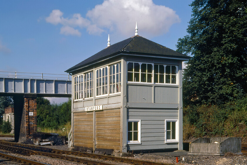 Stamford signal Box (Mid, 1893) 
 Stamford signal box is seen at its original and operational location further west than it stands today. It is a standard Midland Railway Type 2b box constructed in 1891. As well as being a block post on the Peterborough to Leicester line it also controlled access to the once extensive goods yard at Stamford. The box still exists today located close to the end of the station platform and has its own Facebook page, see. https://www.facebook.com/signalboxstamford/ 
 Keywords: Stamford signal Box