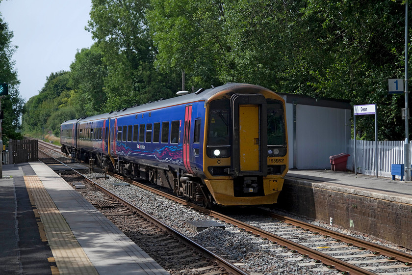 158952, GW 12.30 Cardiff Central-Portsmouth Harbour (1F17, 2L), Dean station 
 Dean station is situated just east of Salisbury. It is a delightfully rural spot set in a quintessentially perfect village! The Wiltshire and Hampshire border actually crosses the line and the platforms just behind where I am standing. 158952 passes the station working the 12.30 Cardiff Central to Portsmouth Harbour. 
 Keywords: 158952 1F17 Dean station