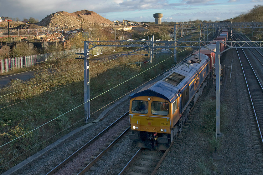 66769, 10.46 Felixstowe North-Hams Hall (4M23), site of Roade station 
 66760 leads the 10.46 Felixstowe to Hams Hall Freightliner service past Roade's new volcano! The huge new pile of crushed concrete marks the remains of the former Pinaoforte factory that has been undergoing complete demolition over the last year or so to make way for a large and new housing estate. This particular Class 66 is just approaching its first birthday, arriving on UK soils last December arriving at Newport docks aboard the oddly named MV Happy Rover. 
 Keywords: 66769 10.46 Felixstowe North-Hams Hall 4M23 site of Roade station GBRf Freightliner