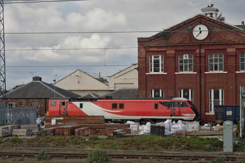 91103, being stripped, Doncaster Works 
 91103 made its final journey north to Doncaster from Bounds Green on October 7th 2020 but not on the rails but on the back of a low loader. It had already been partially stripped at the North London depot to provide spares for the remaining IC225 sets retained for use by LNER. However, as can be seen in this image, the cutters have been at work with their oxyacetylene and have removed the nose cone. The last photograph that I have of this locomotive was taken two years ago in Lincolnshire showing it doing what it was designed to do....how different to now, see....https://www.ontheupfast.com/p/21936chg/26273759604/x91113-08-03-london-king-s-cross 
 Keywords: 91103 being stripped Doncaster Works