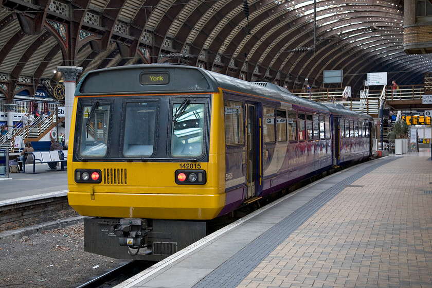 142015, NT 17.29 York-Leeds (2C51), York station 
 Pacer 142015 stands idle at York's platform eight waiting to work the 17.29 Leeds service via Harrogate. There used to be a second north-facing bay platform witnessed by the empty trackbed to the left that was removed some years ago during one of York's several restructurings! 
 Keywords: 142015 17.29 York-Leeds 2C51 York station Northern Pacer