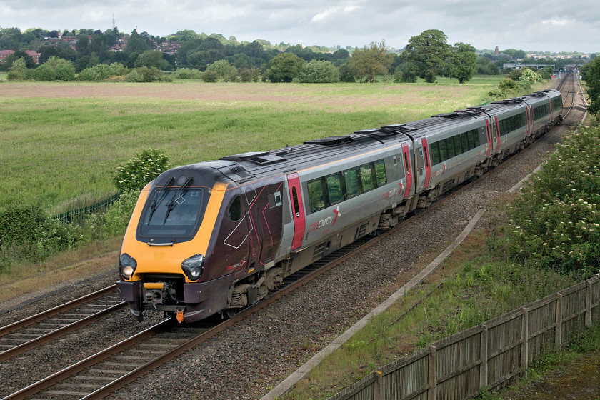 221129, XC 05.45 Sheffield-Reading (1V81, 4E), Warkworth SP476394 
 221129 has just left Banbury, that can be seen in the background, with the 05.45 Sheffield to Reading service. The picture is taken from the top of a retaining wall of a bridge that carries the M40 motorway. So, the largely rural scene is not as quiet as you may imagine with vehicles thundering just a few feet behind where I am sitting! 
 Keywords: 221129 05.45 Sheffield-Reading 1V81 Warkworth SP476394