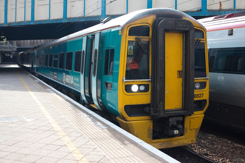 158827, AW 09.10 Birmingham International-Holyhead (1D12), Birmingham New Street station 
 ATW's 158827 pauses at Birmingham New Street forming the 09.10 Birmingham International to Holyhead. An interesting journey from the dead centre of the country to the north west tip of Wales. Whilst a unit would not be my choice to make the journey in, a class 158 would be the best of the options available. 
 Keywords: 15882 09.10 Birmingham International-Holyhead 1D12 Birmingham New Street station