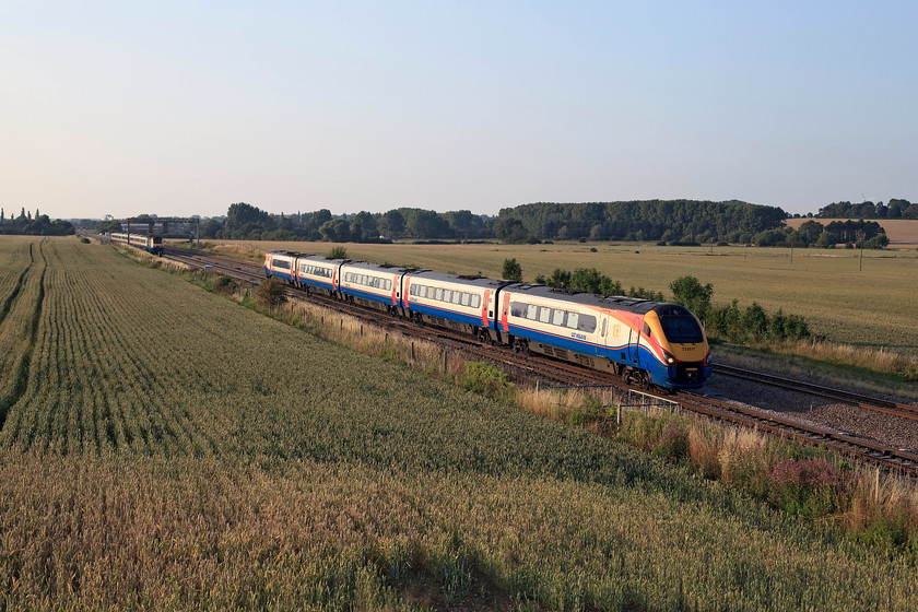 222017, EM 17.38 Sheffield-London St. Pancras (1C72, 1L) & 43047 & 43083, EM 18.15 London St. Pancras-Leeds (1D62, 1E), Harrowden Junction 
 222017 crosses Harrowden Junction working the 17.38 Sheffield to St. Pancras. In this balmy summer evening view the HST heading north out of shot is the 18.15 St. Pancras to Leeds. 
 Keywords: 222017 1C72 43047 43083 1D62 Harrowden Junction