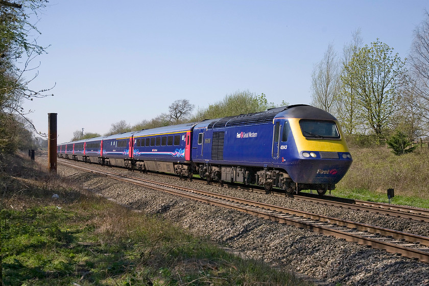 43143, GW 11.55 Cardiff Central-London Paddington (1L54), Knighton crossing SU276890 
 Since my last visit to Knighton crossing just over a month ago, see.... https://www.ontheupfast.com/v/photos/21936chg/C343908004/x10-gwml-27-02-03-03-15 , things have progressed a little more significantly with regard to the much delayed electrification of the GWML. As can be seen in this image, the piling that will receive a mast is in place ready to be pounded into the ground whilst the others around it have already had the treatment. 43143 'Stroud 700' leads the 11.55 Cardiff Central to Paddington hst service. It is a delightful spring day in the west Oxfordshire countryside with the trees just coming into leaf. 
 Keywords: 43143 11.55 Cardiff Central-London Paddington 1L54 Knighton crossing SU276890