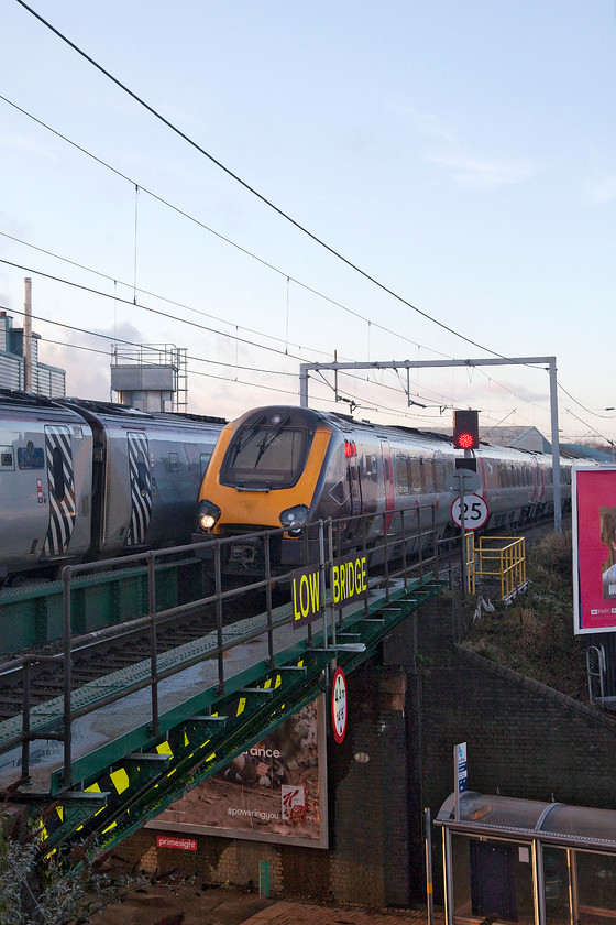 221102, VT 13.43 London-Euston-Glasgow-C (9S77) & class 22X, XC 14.07 Manchester P-Paignton (1V59, 4L), Sandwell & Dudley station 
 As Virgin Trains' 221102 leaves Sandwell and Dudley station forming the 13.43 London Euston to Glasgow Central (9S77) an unidentified class 22X arrives forming the Crosscountry 14.07 Manchester Piccadilly to Paignton (1V59). I find it a bit bizarre that services like this call at a station like Sandwell and Dudley which many would consider a Birmingham commuter station (tin hat anybody!) 
 Keywords: 221102 9S77 class 22X 1V59 Sandwell & Dudley station