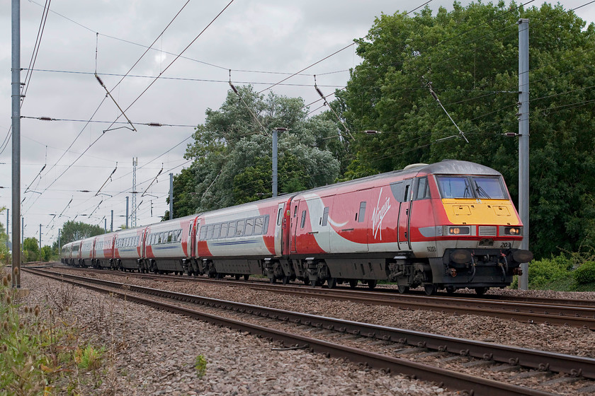 82203, GR 06.00 Berwick-upon-Tweed-London Kings Cross (1Y14, 2E), Gills Crossing 
 DVT 82203 leads the 06.00 Berwick to London King's Cross train through Offord Cluny. The picture is taken from the security of Gill's Crossing in the village that allows access for pedestrians and dog walkers down to the riverside just behind me. Unfortunately, I suspect that Network Rail will close this crossing soon deeming it unsafe. This despite that it's equipped with secure gates and fencing complete with colour lights indicating when it's safe to cross. 
 Keywords: 82203 1Y1 Gills Crossing