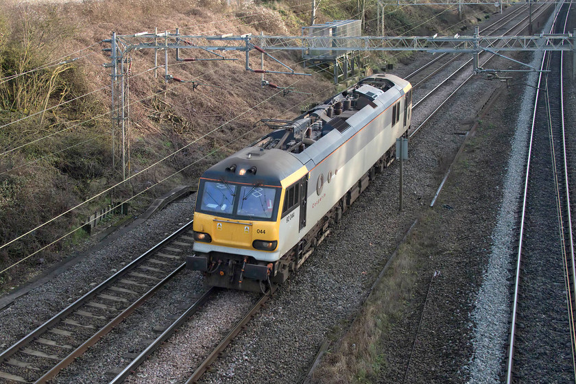 92044, 12.48 Wembley Receptions-Crewe HS (0Z91), Victoria bridge 
 Class 92s have become increasingly rare on the WCML unless hauling sleeper services so the passage of 92044 'Couperin', even if a light engine, was enough to tempt me out. Amazingly, this locomotive still carries its GB Railfreight/Europorte branding and livery that it has worn for many years. Running as 0Z91, 12.48 Wembley to Crewe, it is seen passing Victoria bridge between Northampton and Milton Keynes. 
 Keywords: 92044 12.48 Wembley Receptions-Crewe HS 0Z91 Victoria bridge