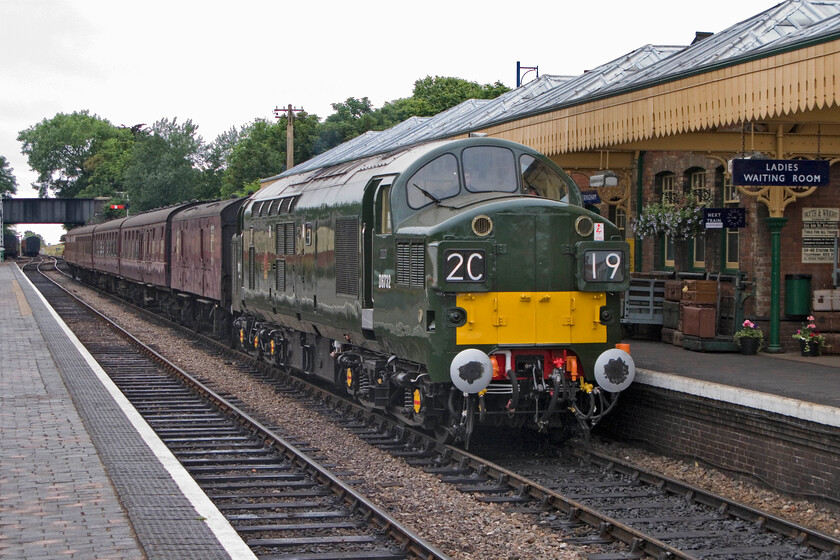 D6732, 17.30 Holt-Sheringham, Sheringham station 
 The final service train of the day arrives at Sheringham station, the 17.30 ex Holt. It is led by the superbly overhauled D6732 that entered service last month (June 2013). It wears an authentic 'as built' livery that is as near as possible to how it would have looked when it was delivered new to Hull Dairycoates shed on 09.03.62. pre-dating me by almost two years! 
 Keywords: D6732 17.30 Holt-Sheringham Sheringham station Type 3 Class 37 37032