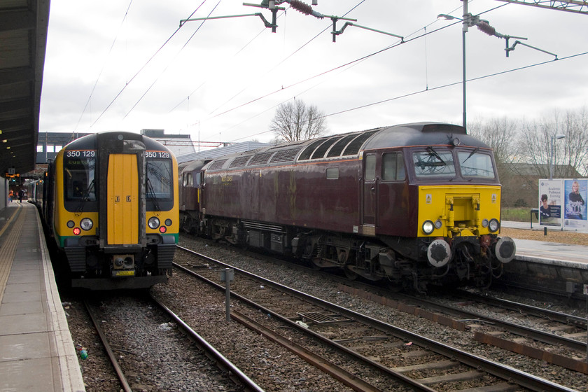 350129, LM 11.33 Birmingham New Street-London Euston (1W12) & 57313, 47746, 10.32 Southall WCR-Carnforth Steamtown (0M43), Northampton station 
 I had been observing the progress of a strange working heading northwards along the WCML for some time on Opentraintimes and figured that it would pass through Northampton station just as our train south would arrive. I was spot on with my estimate as here it is being led by 57513 and 47746 passing the 11.33 Birmingham New Street to Euston formed by 350129. The 57 and 47 combo with 57001 and 33029 along for the ride on the rear, were forming the 10.32 Southall WCR to Carnforth Steamtown 
 Keywords: 350129 11.33 Birmingham New Street-London Euston 1W12 57313 47746 10.32 Southall WCR-Carnforth Steamtown 0M43 Northampton station