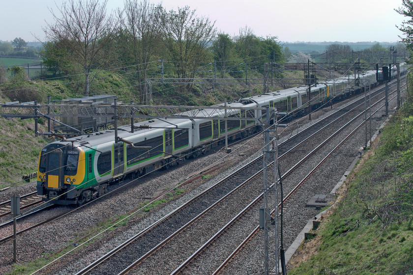 350246, LN 10.45 London Euston-Northampton (2N23, 1E), Victoria bridge 
 A trio of London Northwestern Desiros led by 350246 pass Victoria bridge south of Roade with the 10.45 Euston to Northampton 2N23 service. Unlike the previous days, the light is spoilt on this day by some troublesome high cloud that took the edge off it slightly. 
 Keywords: 350246 10.45 London Euston-Northampton 2N23 Victoria bridge London Northwestern Desiro