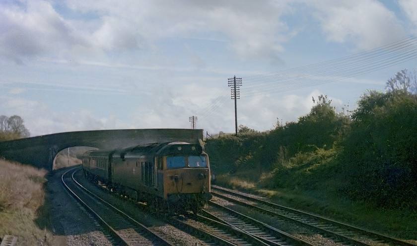 Class 50, unidentified down working, from Fairwood Junction signal box 
 After the KKT railtour had passed, I was invited into the signal box. As it was a Sunday morning there was very little traffic about but I did manage to capture this class 50 on a down working from London Paddington. It is seen coming out of Westbury and about to rejoin the mainline that is to the right more commonly known as the Westbury cut-off. Interestingly, this cut-off was not constructed by the GWR until relatively late in 1933 to relieve pressure on Westbury station and to speed up timings to the West Country.