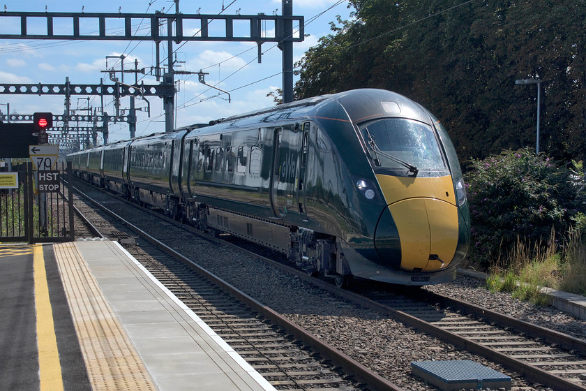 800316, GW 11.36 London Paddington-Cheltenham (1G29, 1E), Didcot Parkway station 
 Taken the wrong side of the sun but Photoshop did a reasonable job to produce a decent image. 800316 drifts into Didcot station forming the 11.36 Paddington to Cheltenham Spa. When it had come to halt, it lowered its pantographs and the engines fired up. I presume that it then ran all the way to its destination on diesel power. 
 Keywords: 800316 11.36 London Paddington-Cheltenham 1G29 Didcot Parkway station