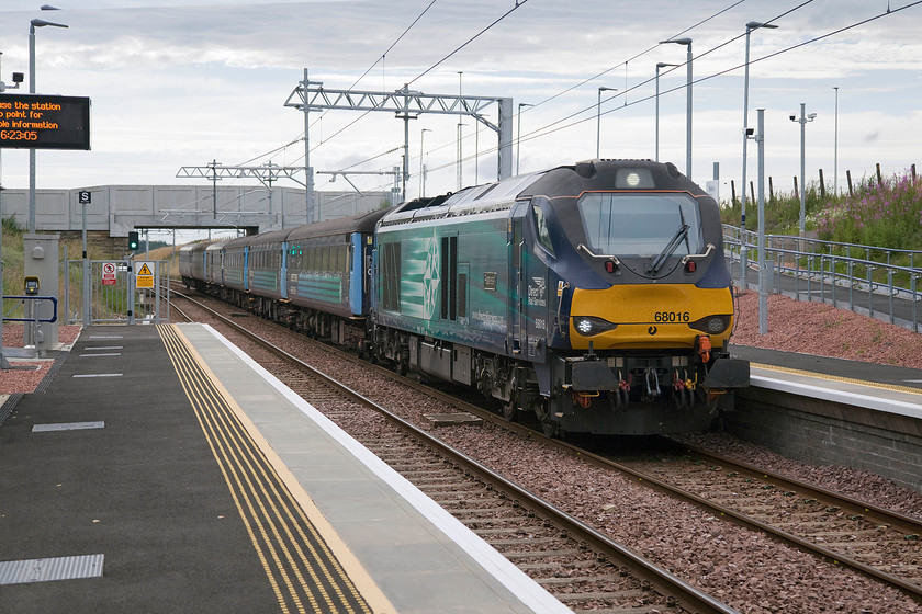 68016, 15.53 Motherwell TMD-Edinburgh Waverley ECS (5L69), Breich station 
 Despite the introduction of the short-set HSTs and the cascading of DMUs, ScotRail is still struggling with capacity. To satisfy demand, they continue to run two evening locomotive-hauled diagrams from Edinburgh departing at 17.07 and 17.19 for Glenrothes with Thornton and Cardenden respectively. There is also a pair of morning commuter services as well. Between duties, the stock is kept and serviced at Motherwell TMD so it makes a number of ECS runs to get to and from Waverley. Here at the newly reconstructed Breich station, 68016 'Fearless' leads the 15.53 Motherwell to Edinburgh 5L69 ECS stock move. This takes the Edinburgh southern avoiding line to arrive into Waverley from the east thus heading loco. first for its commuter service as the services are not top and tailed. Breich station is in a totally isolated location, seemingly in the middle of nowhere directly serving no particular settlements. There was a proposal to close the station in 2014 when it was the tenth least used station on the network with just ninety-two entry and exits. However, railways in Scotland are viewed in a somewhat different light and closure proposals were overturned and a huge amount spent on the station when the line was electrified. Let's hope now that the stopping patterns are improved and that more passengers make use of its up-to-date facilities. 
 Keywords: 68016 15.53 Motherwell TMD-Edinburgh Waverley 5L69 Breich station