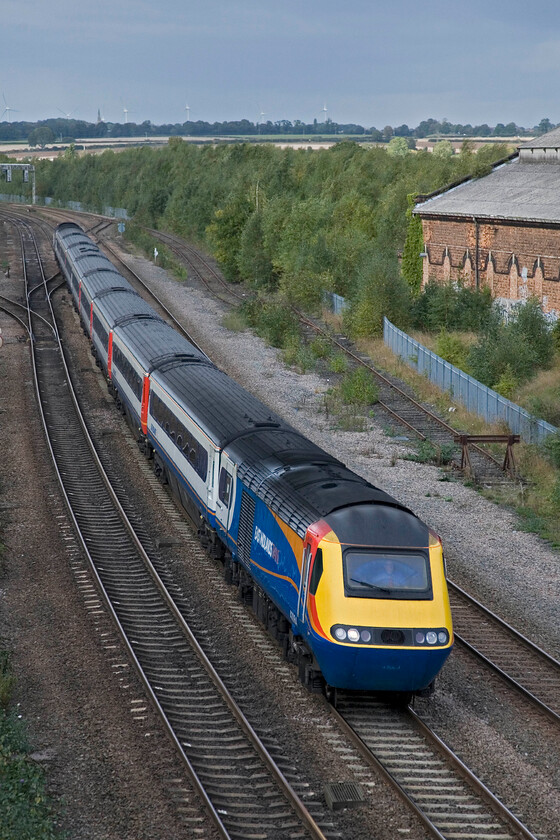 43064, EM 15.28 Nottingham-London St. Pancras (1B58), Mill Road bridge 
 The 15.28 Nottingham to St. Pancras HST service approaches Wellingborough station seen from the lofty heights of Mill Road bridge. The leading power car is 43064 which was first in service as part of Eastern Region's set 254005 back in 1977. Having had our short break from work it is time for Andy and I to head back for the evening shift! 
 Keywords: 43064 15.28 Nottingham-London St. Pancras 1B58 Mill Road bridge EMT HST