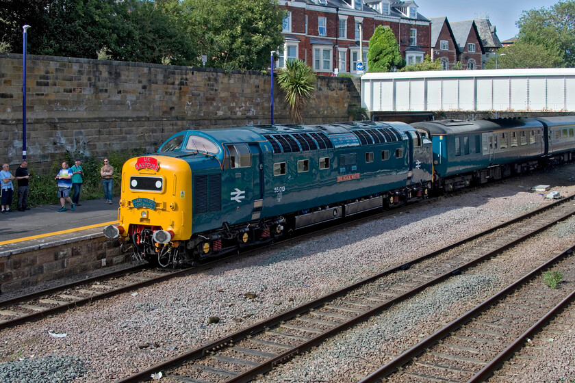 55009 (55013), the return leg of The Coronation Deltic, 17.10 Scarborough-London King's Cross (terminated at Finsbury Park) (17.10 Scarborough-Peterborough) (1Z56, 71L), Scarborough station 
 Taken from the well-known spot on Westwood adjacent to Scarborough station 55009 'Alycidon' is seen switched off at the head of the returning Coronation Deltic charter to King's Cross. Eagle-eyed readers will spot that the Deltic wears the alternative identity of 55013 'The Black Watch'. Some hour or so prior to departure enthusiasts and passengers are beginning to gather again on the platform. 
 Keywords: 55009 55013 The Coronation Deltic 17.10 Scarborough-London King's Cross 1Z56 Scarborough station