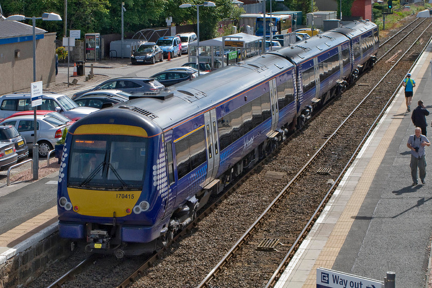 170415, SR 10.57 Inverness-Aberdeen (1A50), Dyce station 
 170415 departs from Dyce station wit the 10.57 Inverness to Aberdeen service. Notice Andy on the down platform walking along with his camera around his neck; a man at one with his hobby! 
 Keywords: 170415 10.57 Inverness-Aberdeen 1A50 Dyce station ScotRail