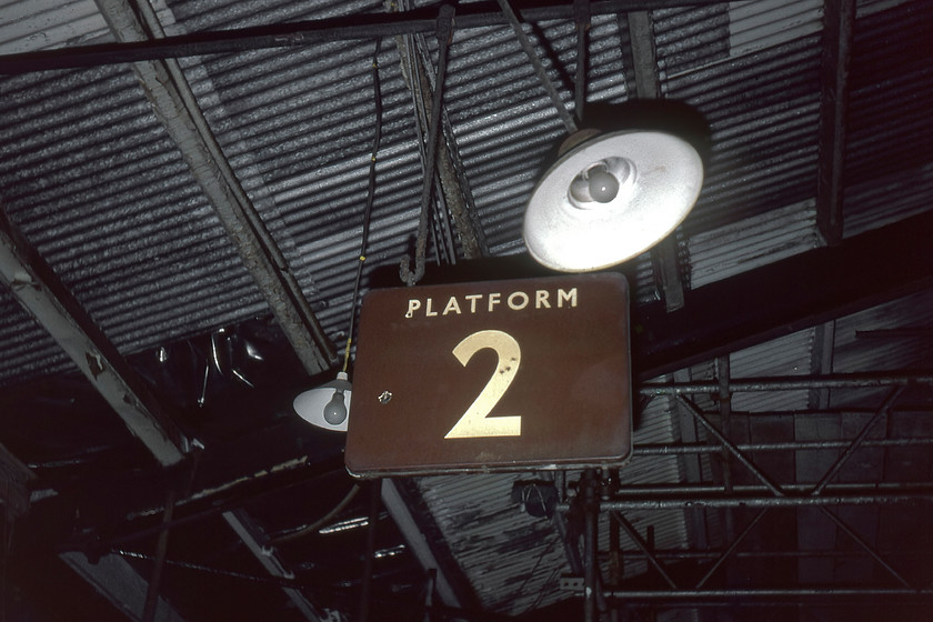 Enamel, Frome station 
 A British Railways (W) enamel sign on Frome station. Notice the replacement white asbestos corrugated roof complete with plastic sheeting above the sign. Also, the scaffolding in place with support being given to the station's structure whilst a decision on the renovation is being made with demolition a distinct possibility. 
 Keywords: Enamel Frome station BR Western