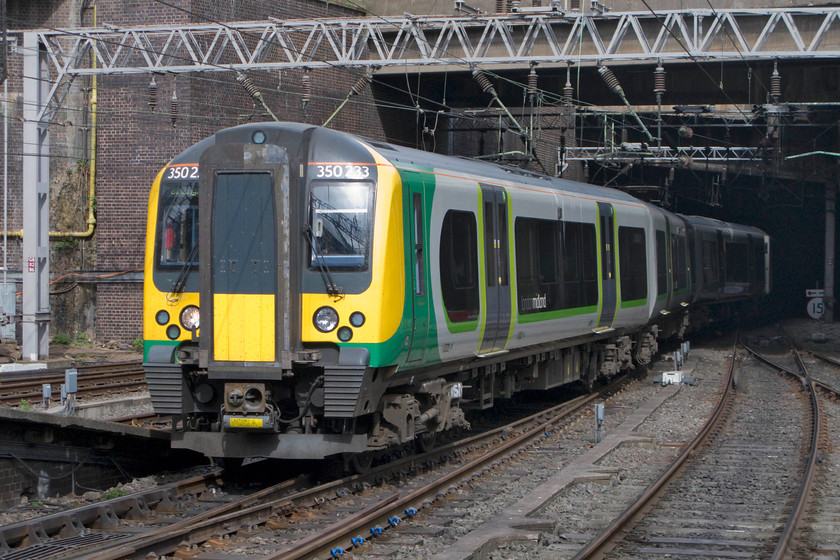 350233, LM 13.49 London Euston-Birmingham New Street (1W15), Birmingham New Street station 
 350233 emerges into some afternoon sunshine at Birmingham's New Street station with the terminating 1W15 13.39 from Euston. 
 Keywords: 350233 13.49 London Euston-Birmingham New Street 1W15 Birmingham New Street station London Midland Desiro