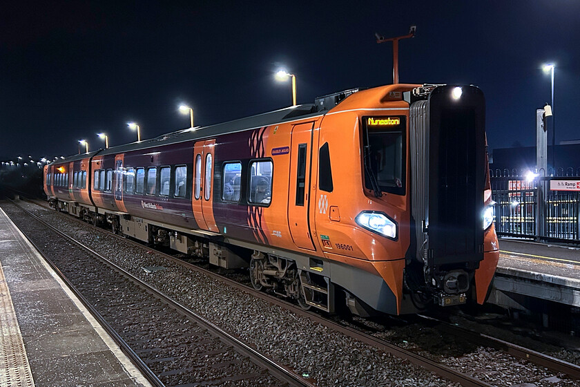 196001, LN 20.40 Leamington Spa-Nuneaton (2G95, 1E), Bermuda Park station 
 Pioneer Civity 196001 'Graiseley Wolves' pauses at Bermuda Park station working the 20.40 Leamington Spa to Nuneaton service. Andy and I had just had our customary evening curry and were heading back to our accommodation when passing the station we realised that a train was due. Having no camera, this image was captured using my mobile 'phone hence the questionable quality! 
 Keywords: 196001 20.40 Leamington Spa-Nuneaton 2G95 Bermuda Park station civity