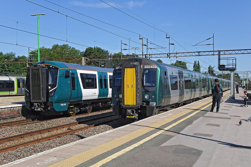 350402, LN 08.36 Birmingham New Street-London Euston (1Y24, RT) & 730213, 07.46 Wembley Yard-Crewe (2Q91, 2L), Northampton station 
 Old and new side by side at Northampton. Before too long the Class 730 Aventras will enter service on routes between London, Birmingham and Crewe meaning that the Class 350/2 Desiros can be returned to Porterbrook. Our train south to London arrives at Northampton led by set 350402 working the 08.36 Birmingham to Euston service. 730213 will soon leave as the 2Q91 07.46 Wembley Yard to Crewe test run. 
 Keywords: 350402 08.36 Birmingham New Street-London Euston 1Y24 730213 07.46 Wembley Yard-Crewe 2Q91 Northampton station London Northwestern Desiro Aventra