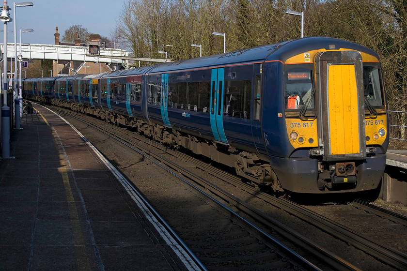 375617 & 375621, SE 13.58 London Charing Cross-Ramsgate (2R42, 1E), Eynsford station 
 Eynsford is 20 miles from London Victoria and is situated between Swanley and Shoreham. It enjoys a regular service provided by South Eastern and Thameslink. 375617 and 375621 are passing through the station with the 13.58 Charing Cross to Ramsgate working. 
 Keywords: 375617 375621 13.58 London Charing Cross-Ramsgate 2R42 Eynsford station