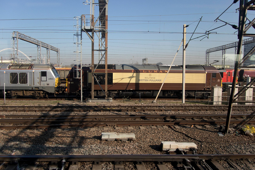 67012, 67021 & 90019, stabled, Wembley Yard 
 Passing through Wembley Yard reveals three locomotives stabled. Still in its smart Wrexham and Shropshire silver livery is 67012 is adjoined to 67021 in its Belmond British Pullman brown and cream. Just putting in a appearance behind the 67s is 90019 'Multimodal'. 
 Keywords: 67012 67021 90019 Wembley Yard