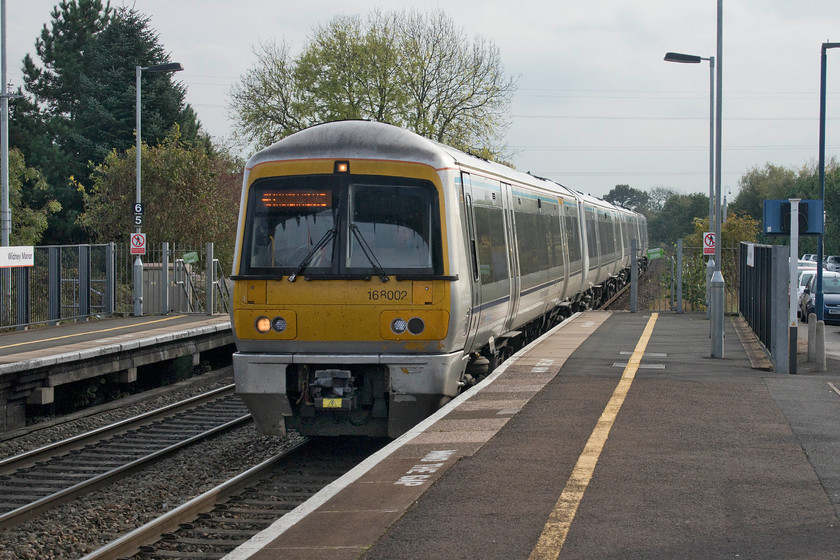 168002, CH 11.40 London Marylebone-Birmingham Snow Hill (1G27, 4L), Widney Manor station 
 168002 is passing at speed through Widney Manor station working the 11.40 Marylebone to Birmingham Snow Hill service. These units form the backbone of services on what is colloquially known as the Chiltern Line but they are now supplemented by some 'fast' loco.-hauled workings that appear to be prooving popular with customers. 
 Keywords: 168002 11.40 London Marylebone-Birmingham Snow Hill 1G27 Widney Manor station