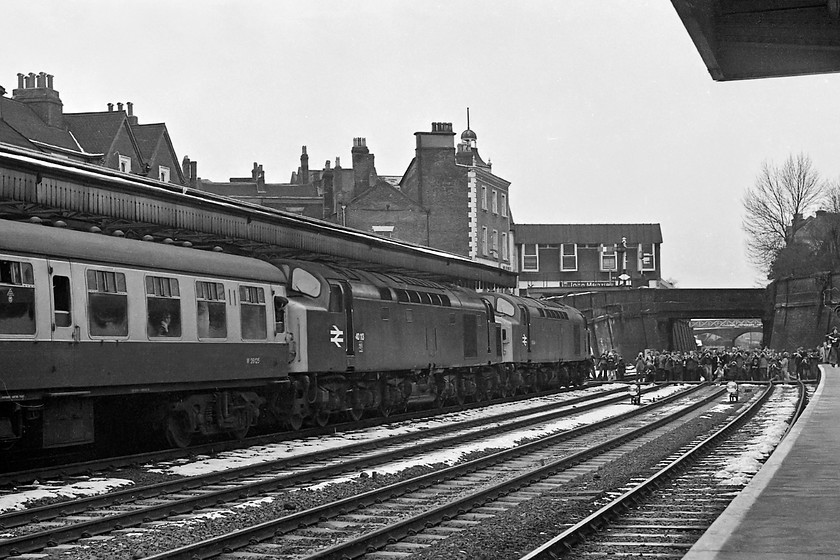 40144 & 40113, outward leg of The Crewe Campaigner Relief, 07.35 London Paddington-Crewe (1Z68), Wellington station 
 Look at the crowds massing on the barrow crossing and tracks getting their photographs of The Crewe Campaigner Railtour Relief as it has a photo-stop at Wellington station, could you ever imagine this being permitted today? 40144 and 40113 are leading the train on the leg from Birmingham to Crewe via Shrewsbury. Notice the branch of John Menzies above the bridge on what is Church Street. Their bookstalls were a familiar site on stations for many years, all of these, including the the high street branches, were sold to WH Smith in 1998 but the Menzies group of companies is still going strong in a number of key areas such as distribution and aviation support. 
 Keywords: 40144 40113 The Crewe Campaigner Relief 07.35 London Paddington-Crewe 1Z68 Wellington station