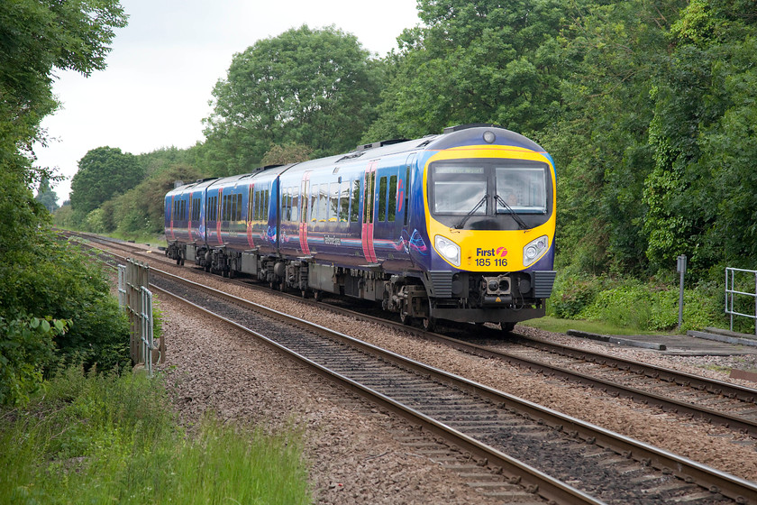 185116, TP 13.27 Middlesborough-Manchester Airport (1P43), Low Gates level crossing 
 Slowing for its stop at Northallerton station, 168116 approaches the outskirts of the town at Low Green level crossing. It is forming the 1P43 13.27 Middlesborough to Manchester Airport service. 
 Keywords: 185116 13.27 Middlesborough-Manchester Airport 1P43 Low Gates level crossing