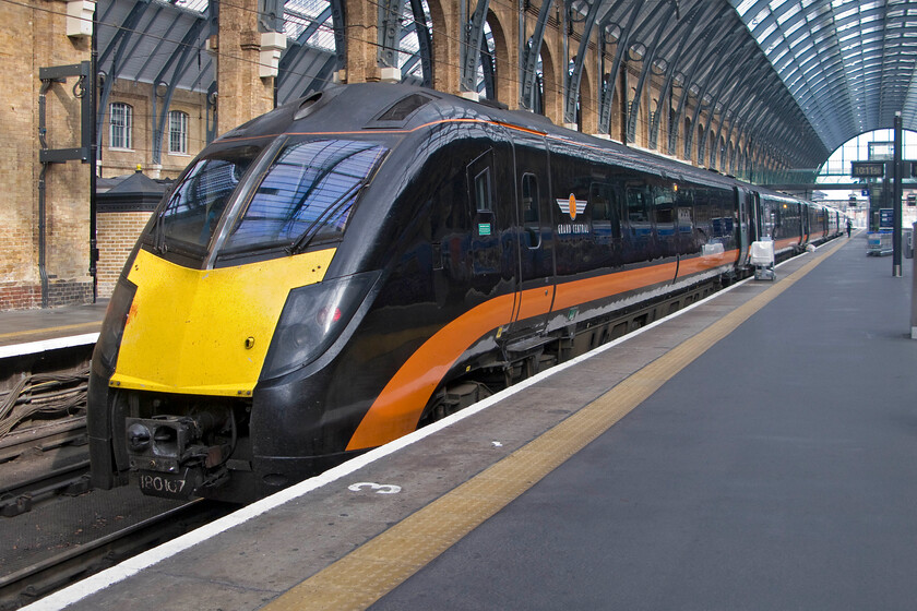 180107 GC 06.55 Bradford Interchange-London King's Cross, London King's Cross station 
 Having recently arrived 180107 rests at King's Cross' buffer stops. It has worked the Grand Central 06.55 from Bradford Interchange offering an alternative and direct way of getting to the capital rather than using Northern and East Coast from Leeds. Notice the crude application of the set's number just below the Dellner coupling. 
 Keywords: 180107 06.55 Bradford Interchange-London King's Cross London King's Cross station Grand Central Aldante