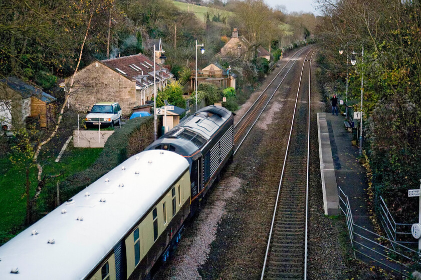 67005, return leg of VSOE excursion, 15.55 Bath Spa-London Victoria (1ZXX), Avoncliff station 
 With it being a week off the shortest day and just past 16.00 the light is fading fast! Pushing the camera to its limits and with judicious use of Photoshop has captured 67005 'Queen's Messenger' passing Avoncliff station leading the returning 15.55 Bath to Victoria VSOE excursion. Passengers have enjoyed a day in the fine Georgian city with its huge Christmas market in full swing. The photograph is taken from Avoncliff's impressive aqueduct that carries the Kennet and Avon canal over the railway and the river. 
 Keywords: 67005 VSOE excursion 15.55 Bath Spa-London Victoria 1ZXX Avoncliff station Queen's Messenger