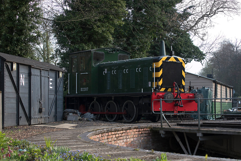 D2207, stabled, Pickering station car park sidings 
 On our drive to Whitby, Andy and I stopped off at the North Yorkshire Moors Railway station at Pickering. Stabled on the turntable, adjacent to the car park, is D2207 that looks superb in its British Railways green livery. The class 04 shunter, that was withdrawn in 1967 thus never receiving a TOPS number, is used all over the NYMR for stock movements and shunting. 
 Keywords: D2207 Pickering station car park sidings