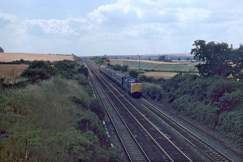 55010, 10.05 London King`s Cross-York (1L01), Eaton Wood SK723774 
 55010 'The King's Own Scottish Borderer' leads the 10.05 King's Cross to York 'fast' working past Eaton Wood south of Retford. Since my last visit exactly a year previously, the crossing keeper's house at the former Gamston level crossing has been demolished, see.....https://www.ontheupfast.com/v/photos/21936chg/25410452004/x55003-15-00-london-kings-cross-aberdeen The up relief loop is also in place, a situation that remained until electrification some ten years after this picture was taken. 
 Keywords: 55010 10.05 London King`s Cross-York 1L01 Eaton Wood SK723774