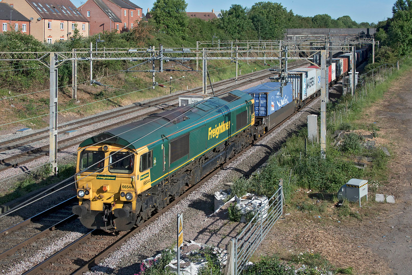 66544, 03.39 Garston-London Gateway (4L32, 9E), site of Roade station 
 66544 leads the 03.39 Garston to London Gateway through Roade hot on the heels of the previous Coatbridge to Felixstowe Freightliner. This morning is the start of yet another glorious day that has characterised most of May throughout the COVID-19 lockdown period. 
 Keywords: 66544 03.39 Garston-London Gateway 4L32 site of Roade station Freightliner