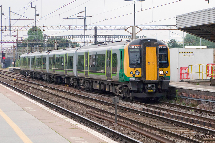 350120, LM 07.33 Birmingham New Street-London Euston (1W04), Northampton station 
 350120 arrives at Northampton's platform one with the 07.33 Birmingham New Street to Euston service. It is a very grey and somewhat chilly June morning just two days prior to the longest day. 
 Keywords: 350120 07.33 Birmingham New Street-London Euston 1W04 Northampton station London Midland Desiro