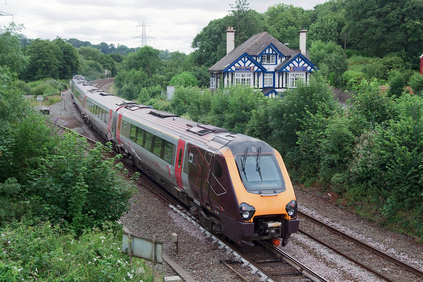 221133, XC 06.28 Penzance-Glasgow Central (1S43, 34L), Cowley Bridge Junction 
 This classic view at Cowley Bridge is becoming somewhat overgrown now but is still instantly recognisable. The New Inn is still trading even though it's blue and white rather than black and white as it appears in most pictures. 221133 heads away north with the 06.28 Penzance to Glasgow Central. It was already late here and this situation did not improve as final arrival time was 34 minute late. 
 Keywords: 221133 1S43 Cowley Bridge Junction