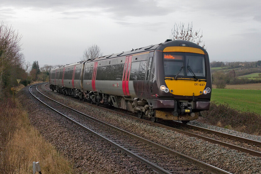 170637, XC 07.05 Gloucester-Cambridge (1L00, RT), Wing SK896034 
 CrossCountry's 170637 passes near the village of Wing working the 07.05 Gloucester to Cambridge service. This location is at a foot crossing deep in the Rutland countryside that seemed a popular route for local dog walkers judging by the number that passed Andy and I whilst we were waiting for the charter. 
 Keywords: 170637 07.05 Gloucester-Cambridge 1L00 Wing SK896034 CrossCountry