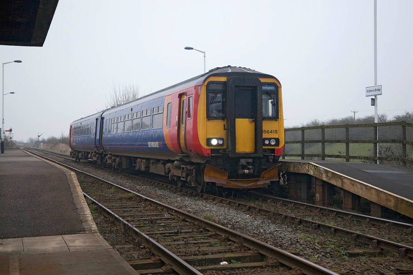 156415, EM 11.15 Skegness-Nottingham (2S12, 1E), Hubberts Bridge station 
 Hubberts Bridge station is situated in a pretty remote spot next to the A1121 road between Sleaford and Boston. It is a station with few facilities and not much passenger patronage, but having said that number did double during 2017 to 1 100. 156415 passes through the station, as most trains do, working the 11.15 Skegness to Nottingham. 
 Keywords: 156415 2S12 Hubberts Bridge station