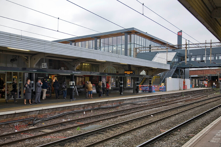 Northampton station old and new (STILL yet to open) 
 By now (the beginning of December 2014) Northampton's new station should be open and in full operation. However, as is all too common today the inevitable overrun steals the headlines rather than the celebratory opening! The new station bridge and lift appears to at the root of the problem along with issues around the new steps at the main entrance. Let's hope that it is dealt with soon and that the station can open giving Northampton's passengers the facility that they deserve. 
 Keywords: Northampton station old and new